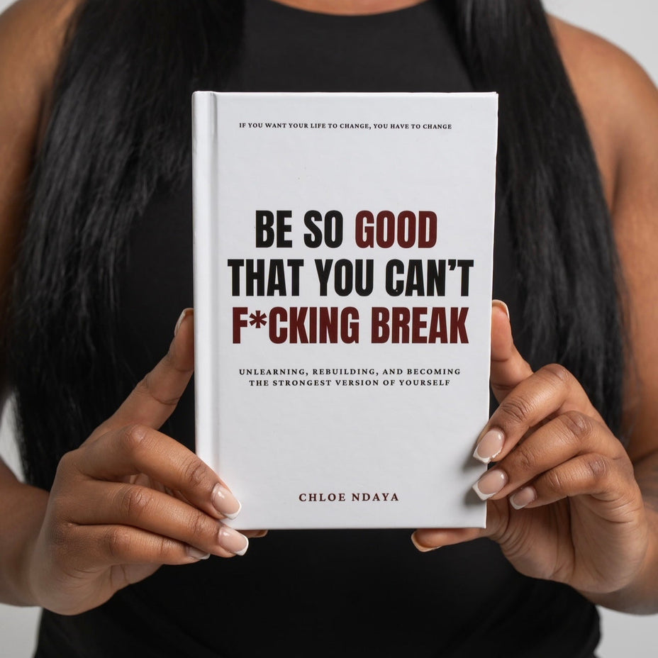 Person holding a book titled 'Be So Good That You Can't F*cking Break' by Chloe Ndaya